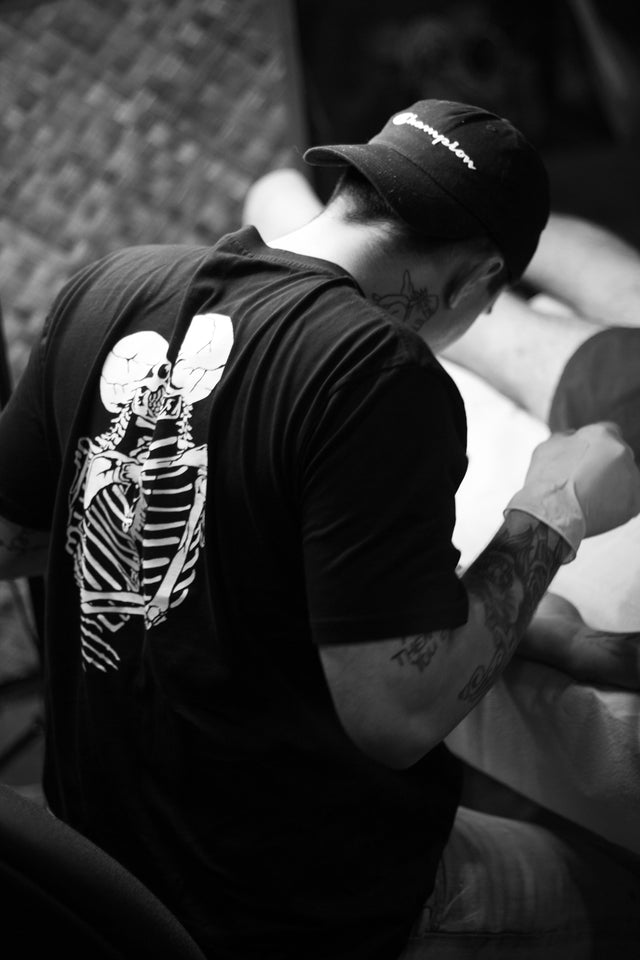 Death & Taxes Kissing Skullies Pocket Tee